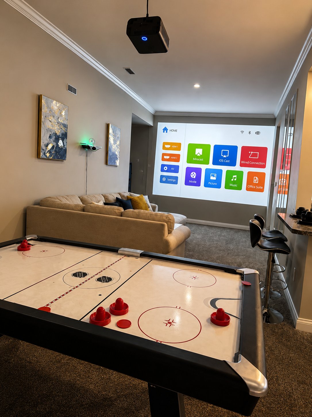 Real property game room with air-hockey table and ceiling projector, part of a Nestlyo Signature Stay example
